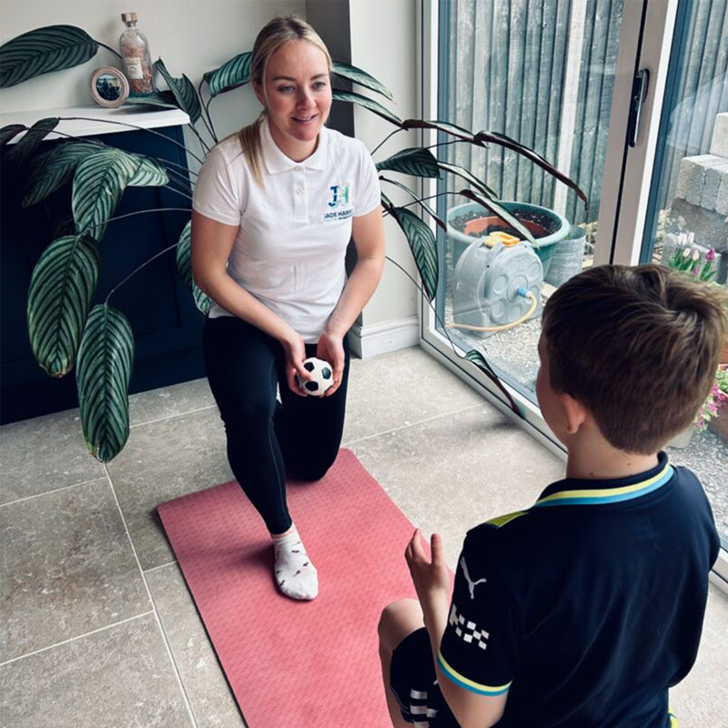 Jade-Harris Physio Ball Throw with Boy